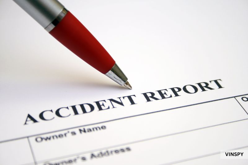 Accident report form and pen related to how to check if a car has been in an accident